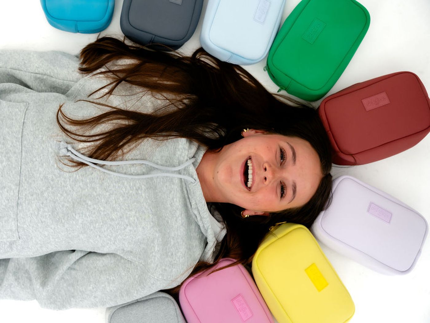 Laughing on the floor with a ring of different-colored SLBs around her head
